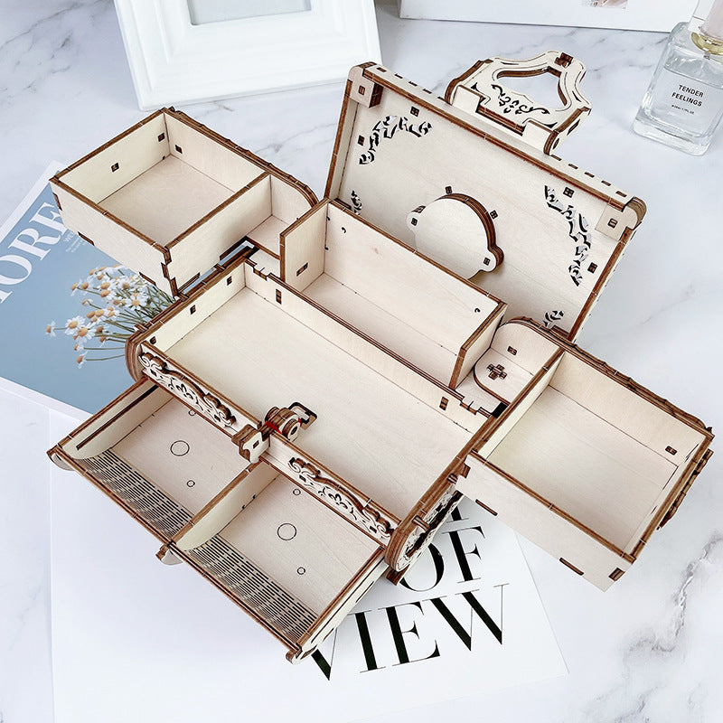 Close-up detail of wooden jewelry box puzzle pieces and music mechanism
