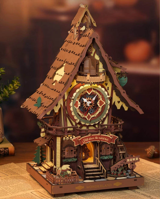 Magic Forest treehouse clock with 4 warm LED lights glowing through windows
