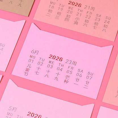 Tear-away page revealing peach blossom forest scene on eco-friendly memo pad