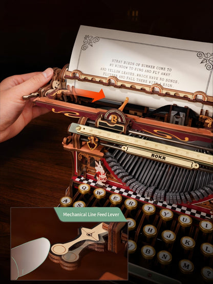 Close-up of a decorative mechanical typewriter with a hand adjusting the paper feed lever, showing detailed brass, wood, and black components. An inset at the bottom highlights the mechanical line feed lever.
